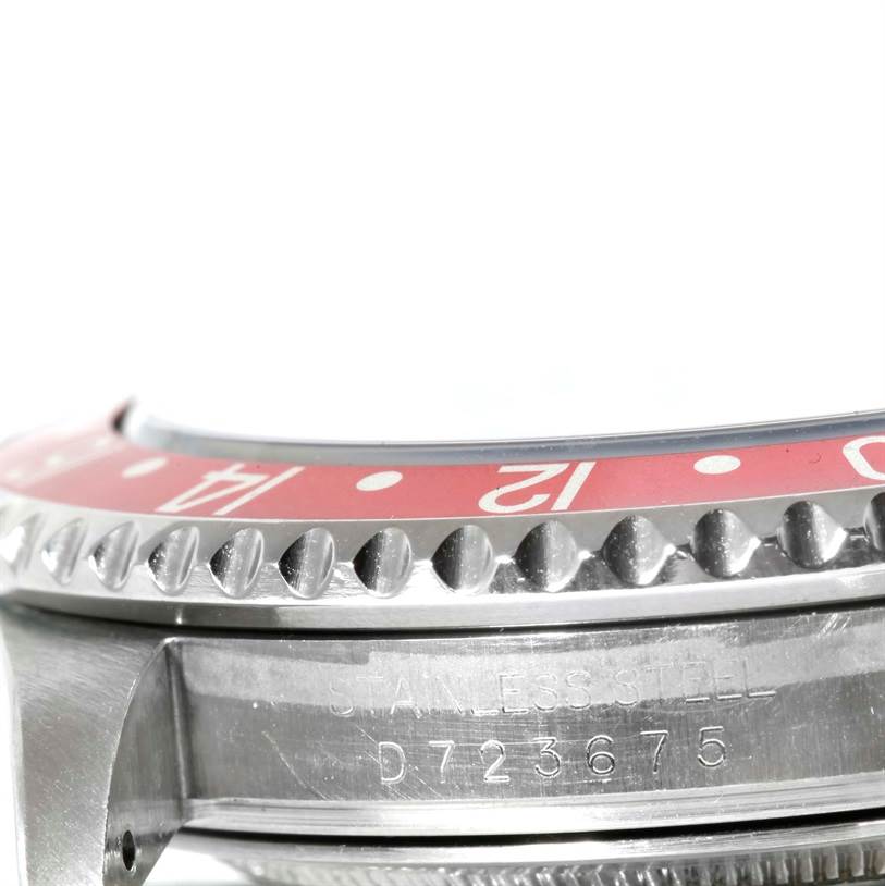This image shows a close-up side angle of a Rolex GMT-Master 16710 Men
s Stainless Steel Black Dial 16710 Men
s Stainless Steel Black Dial watch, highlighting the bezel and engraved case markings.