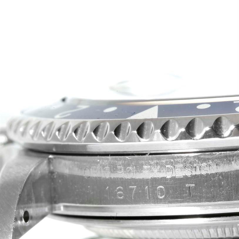 This image shows a close-up side angle of the bezel and case of a Rolex GMT-Master 16710 Men
s Stainless Steel Black Dial 16710 Men
s Stainless Steel Black Dial model watch, emphasizing the model number "16710."