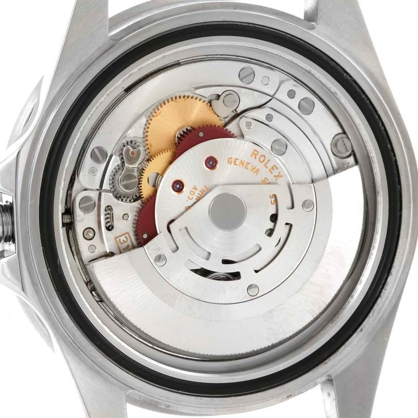 This is a view of the Rolex GMT-Master 16710 Men
s Stainless Steel Black Dial 16710 Men
s Stainless Steel Black Dial
s internal movement, showing gears and rotor assembly.