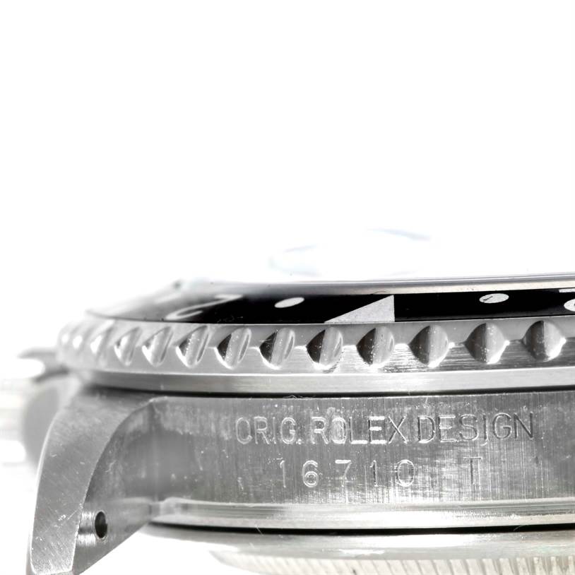 The image shows a side view of the case and bezel of a Rolex GMT-Master 16710 Men's Stainless Steel Black Dial 16710 Men's Stainless Steel Black Dial, highlighting the model and design number engraving.