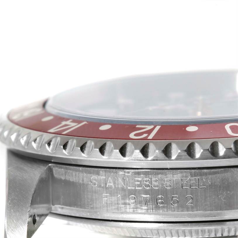 This image shows a close-up side view of a stainless steel Rolex GMT-Master 16710 Men's Stainless Steel Black Dial 16710 Men's Stainless Steel Black Dial watch case and a portion of its bezel.