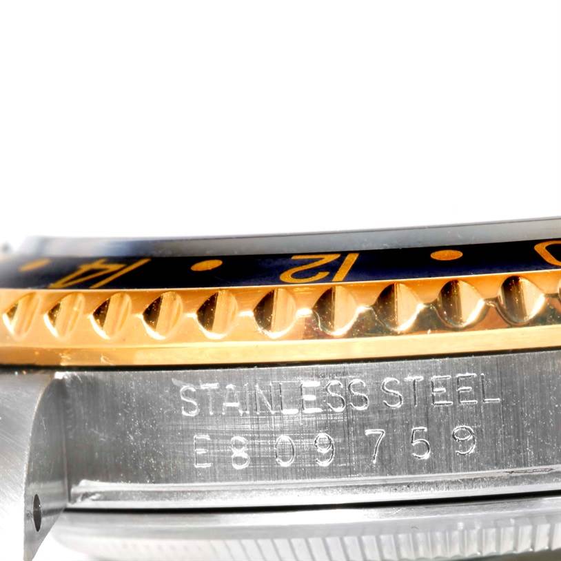 This image shows a close-up side view of the GMT-Master bezel and the engraved stainless steel section by Rolex.