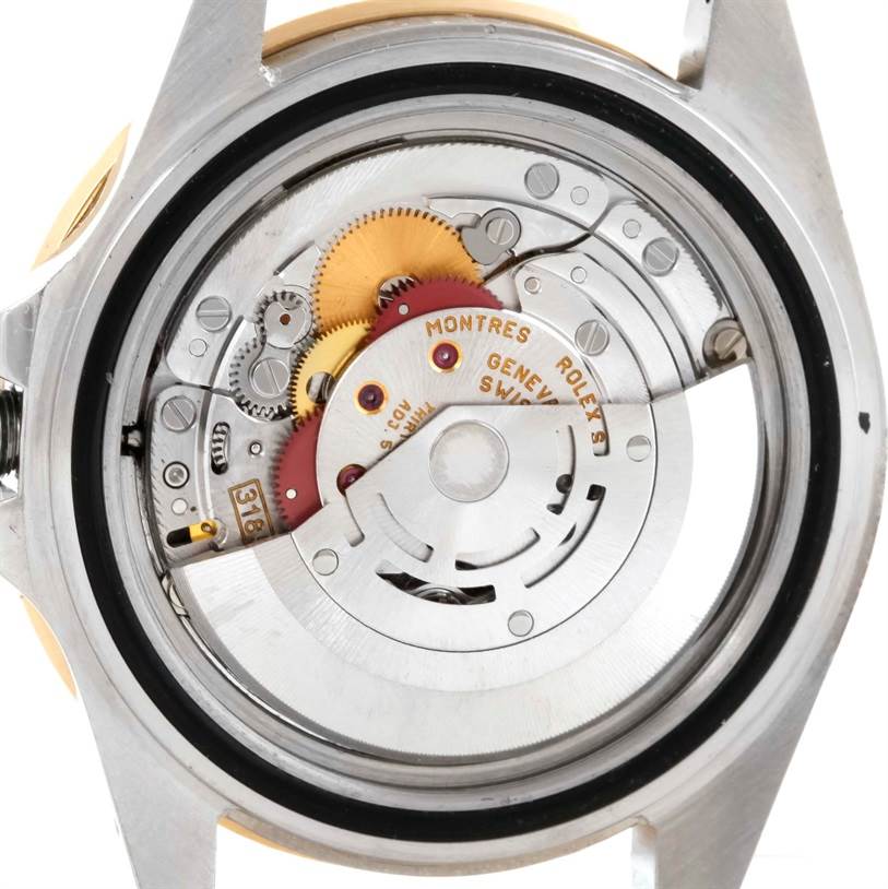 The image shows the backside of a Rolex GMT-Master 16713 Men's Stainless Steel Black Dial 16713 Men's Stainless Steel Black Dial watch, revealing its internal movement components.