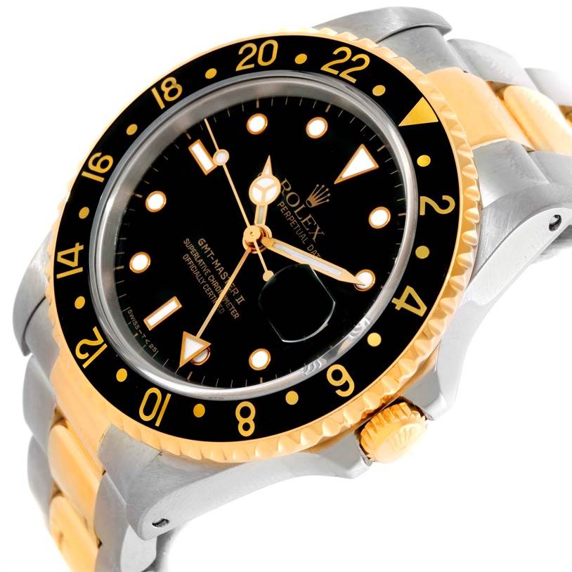 This image shows a Rolex GMT-Master 16713 Men's Stainless Steel Black Dial 16713 Men's Stainless Steel Black Dial model watch at an angled view highlighting its black dial, bi-color bezel, and two-tone bracelet.
