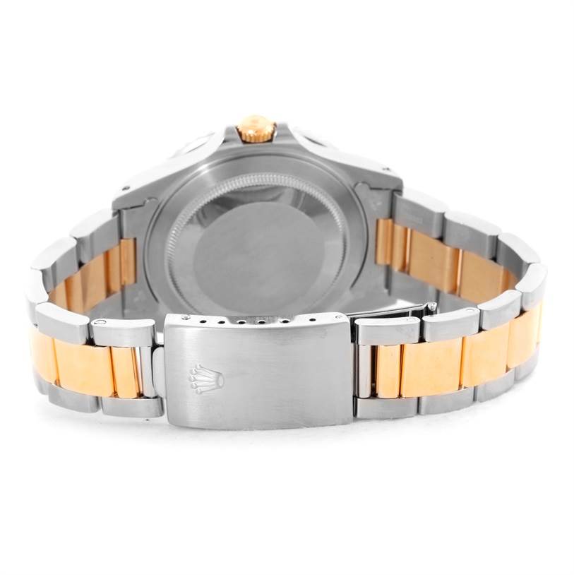 The image shows the back case and the bracelet with the clasp of a GMT-Master model by Rolex.