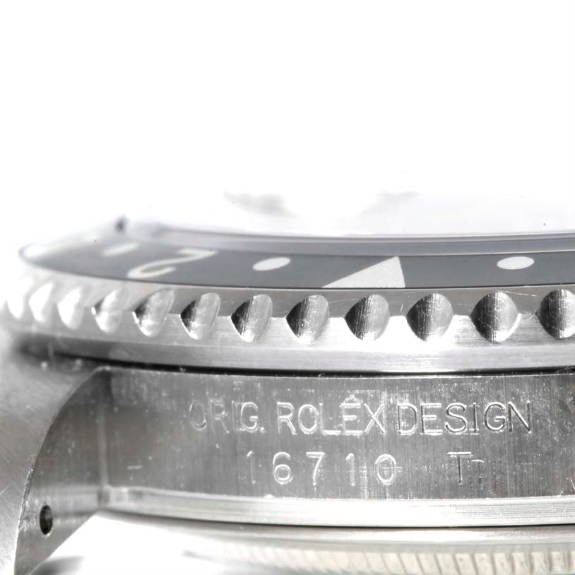This close-up angle of the Rolex GMT-Master 16710 Men's Stainless Steel Black Dial 16710 Men's Stainless Steel Black Dial watch shows the toothed bezel and the engraved model number "16710."