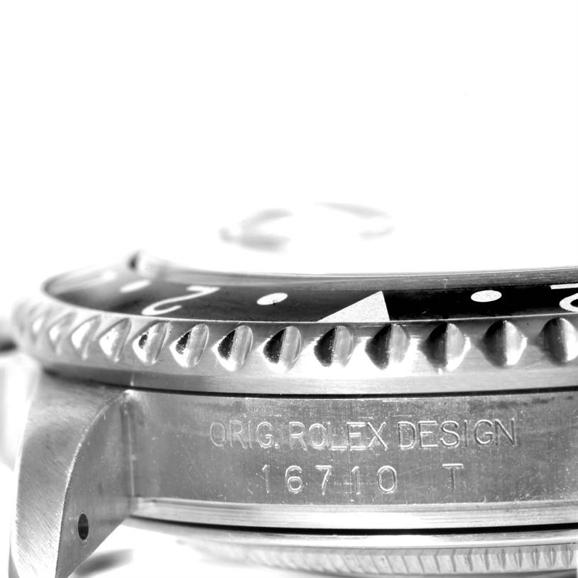 This image shows a close-up side view of the Rolex GMT-Master 16710 Men's Stainless Steel Black Dial 16710 Men's Stainless Steel Black Dial model, featuring its bezel and model number engraving.