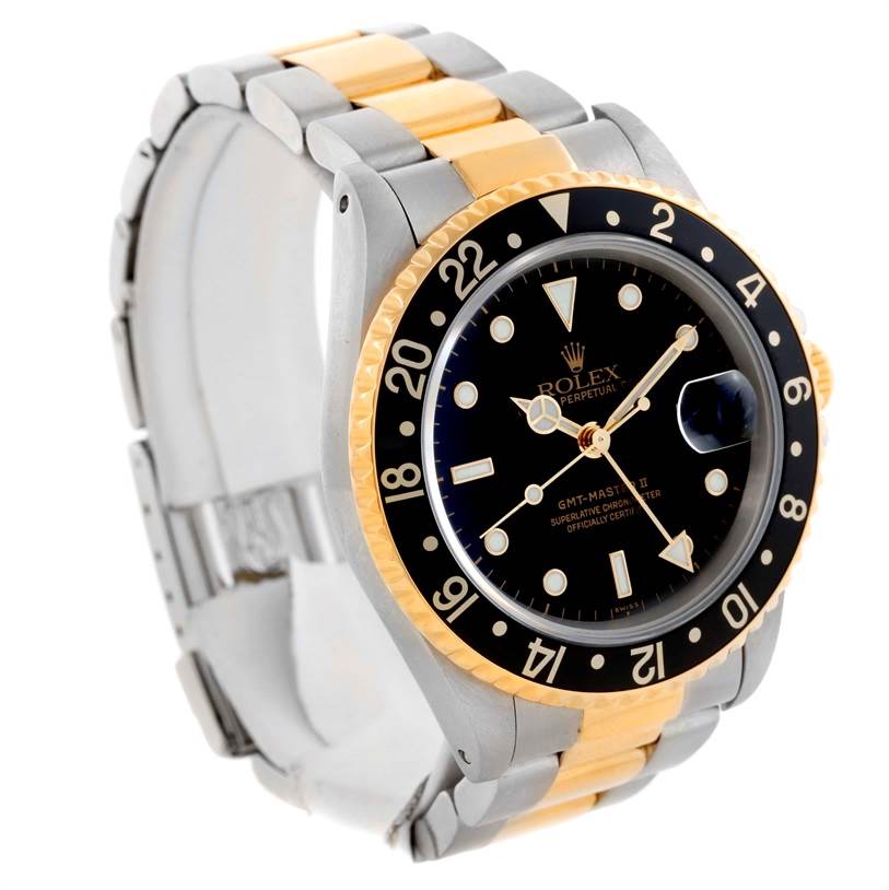 The image shows a Rolex GMT-Master 16713 Men
s Stainless Steel Black Dial 16713 Men
s Stainless Steel Black Dial watch at a 3/4 angle, highlighting its bezel, dial, and two-tone bracelet.