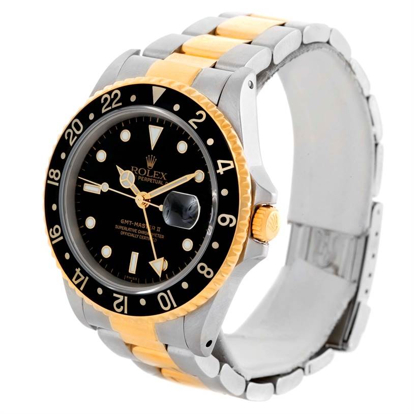 The Rolex GMT-Master 16713 Men
s Stainless Steel Black Dial 16713 Men
s Stainless Steel Black Dial watch is shown at an angle displaying the face, bezel, crown, and two-tone bracelet.