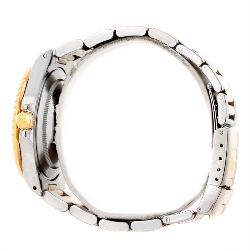 The image shows a side view of a Rolex GMT-Master 16713 Men
s Stainless Steel Black Dial 16713 Men
s Stainless Steel Black Dial watch, highlighting the crown, case, and bracelet.