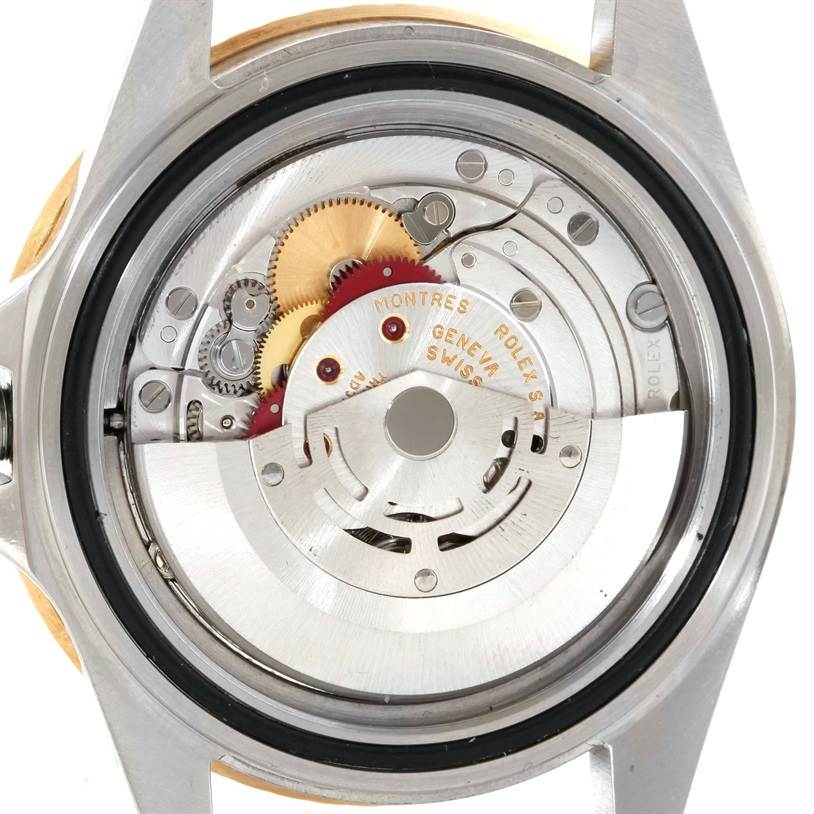 The image shows the internal movement and mechanism of a Rolex GMT-Master 16713 Men
s Stainless Steel Black Dial 16713 Men
s Stainless Steel Black Dial watch from a rear angle.