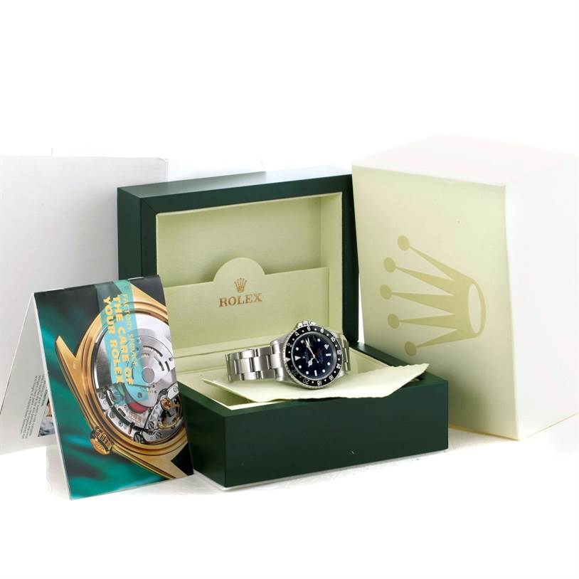 The Rolex GMT-Master 16710 Men's Stainless Steel Black Dial 16710 Men's Stainless Steel Black Dial watch is shown in its box alongside its accessories, viewed from the front.