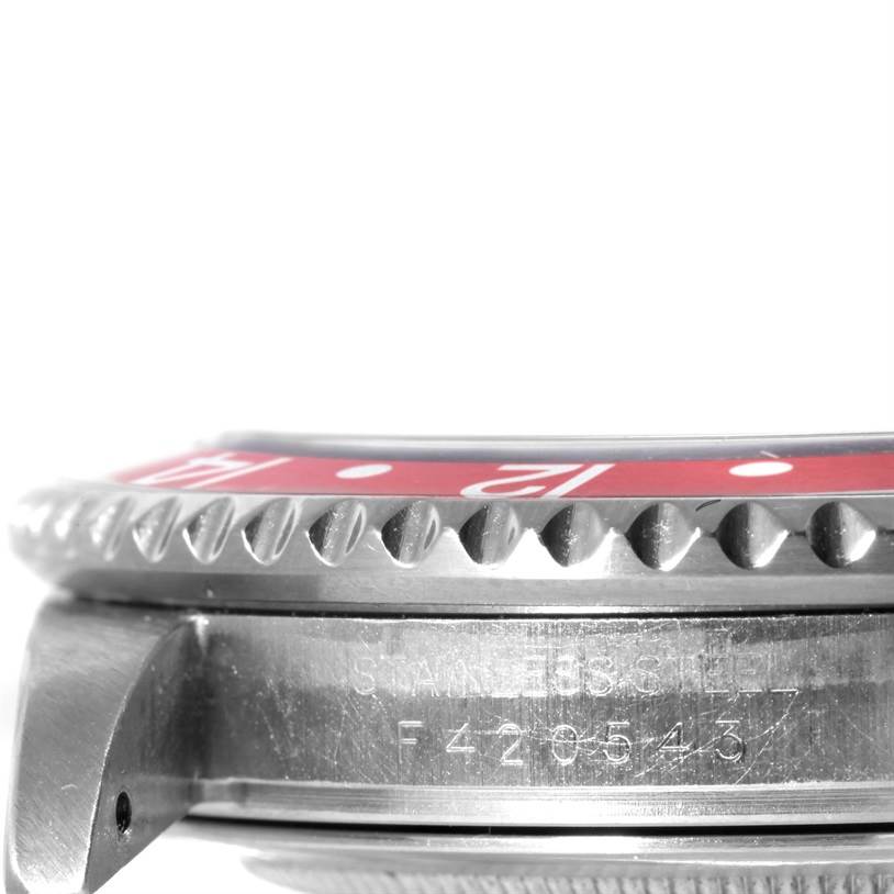 The image shows a close-up side view of the bezel and case of a Rolex GMT-Master 16710 Men's Stainless Steel Black Dial 16710 Men's Stainless Steel Black Dial watch.