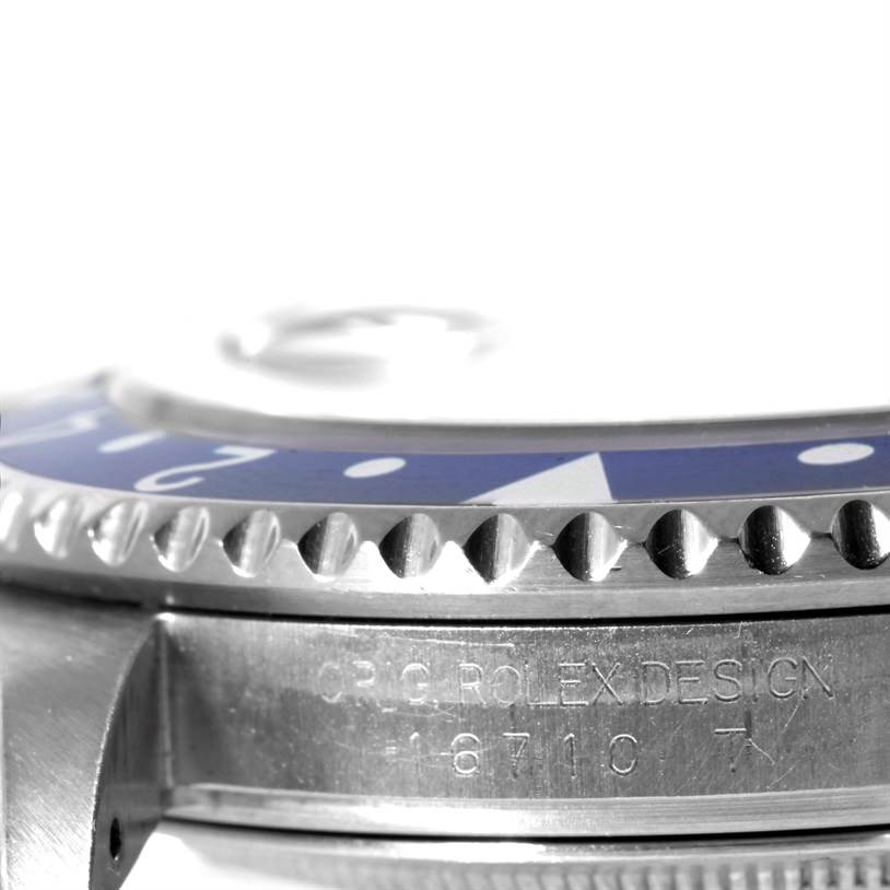 This image shows a side angle close-up of the bezel and lug of a Rolex GMT-Master 16710 Men's Stainless Steel Black Dial 16710 Men's Stainless Steel Black Dial watch.