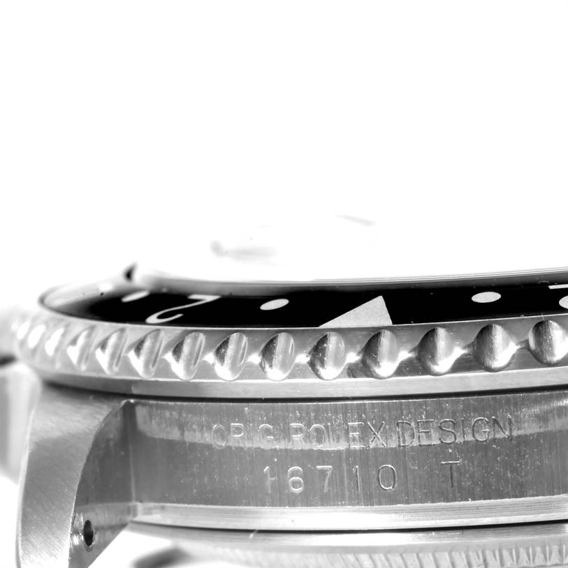 The image shows a close-up angle of the bezel and case side of a Rolex GMT-Master 16710 Men
s Stainless Steel Black Dial 16710 Men
s Stainless Steel Black Dial 16710 watch.