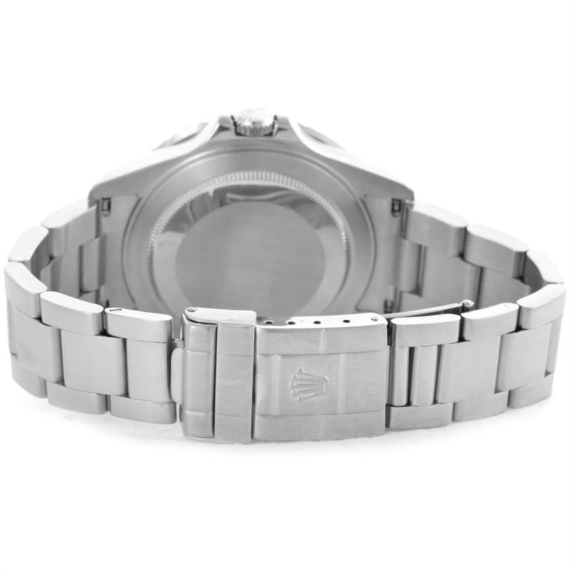 The image shows the back view of the Rolex GMT-Master 16710 Men
s Stainless Steel Black Dial 16710 Men
s Stainless Steel Black Dial watch and its metal bracelet clasp.