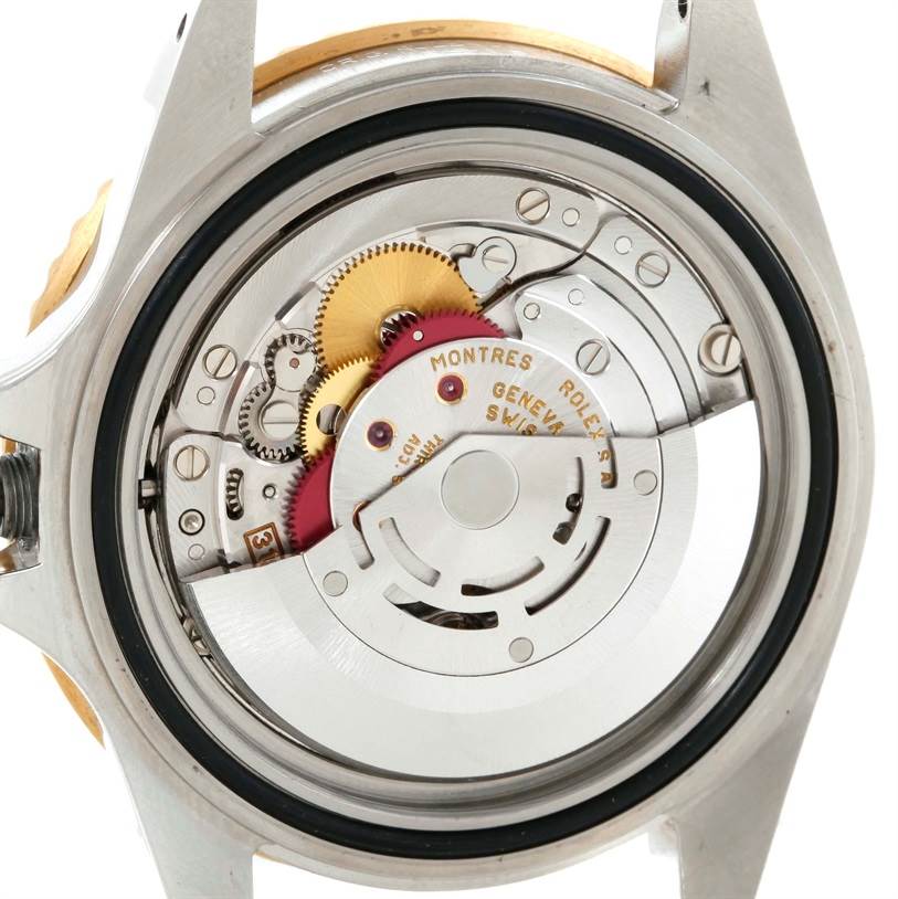 The image shows the back view featuring the internal movement mechanism of the Rolex GMT-Master 16713 Men's Stainless Steel Black Dial 16713 Men's Stainless Steel Black Dial watch.