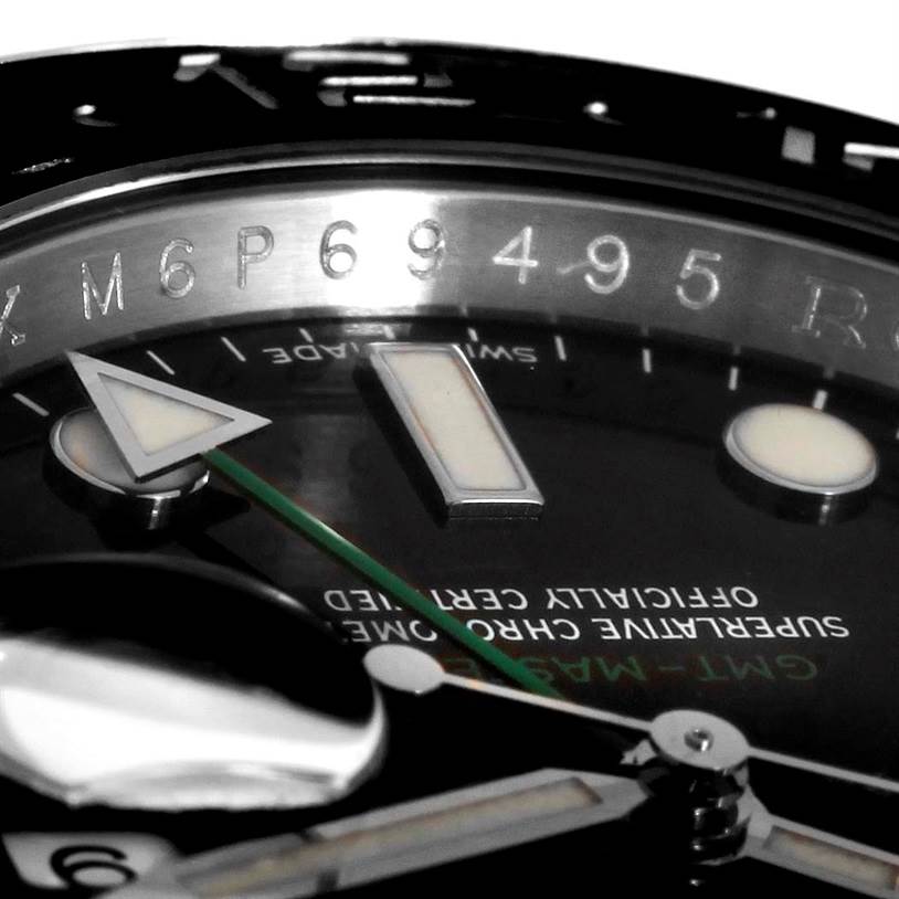 This close-up angle of the Rolex GMT-Master 116710 Men's Stainless Steel Black Dial 116710 Men's Stainless Steel Black Dial model features the dial, hour markers, and hands.