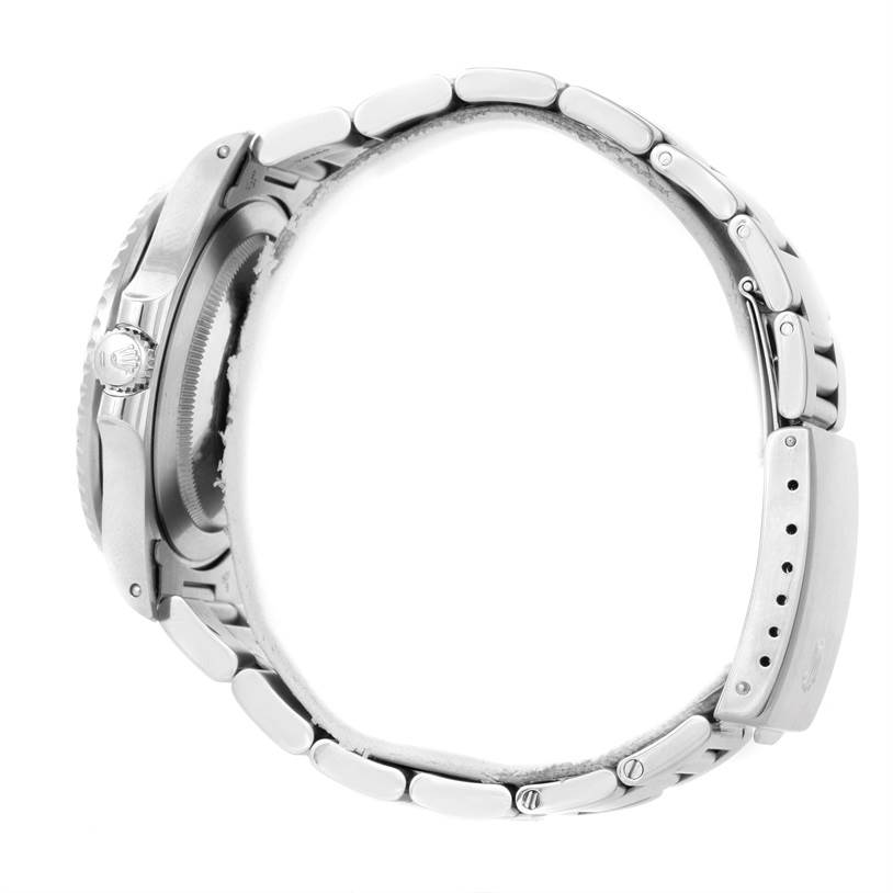 This side view of a Rolex GMT-Master 16700 Men's Stainless Steel Black Dial 16700 Men's Stainless Steel Black Dial watch showcases the crown, case, and bracelet in stainless steel.