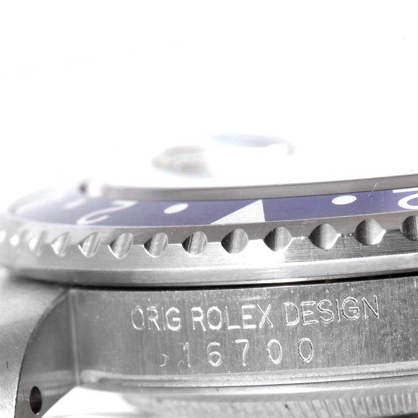 The image shows a close-up side view of the bezel and part of the case of a Rolex GMT-Master 16700 Men's Stainless Steel Black Dial 16700 Men's Stainless Steel Black Dial watch, with the model number 16700 engraved.