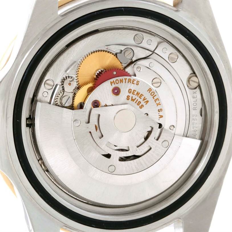 This image shows the movement or inner mechanism of a Rolex GMT-Master 16713 Men's Stainless Steel Brown Dial 16713 Men's Stainless Steel Brown Dial watch from the back.