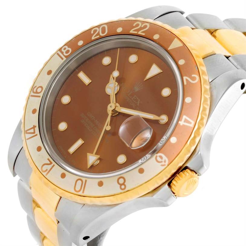 The image shows a close-up angled view of a Rolex GMT-Master 16713 Men's Stainless Steel Brown Dial 16713 Men's Stainless Steel Brown Dial watch, highlighting its dial, bezel, and two-tone bracelet.