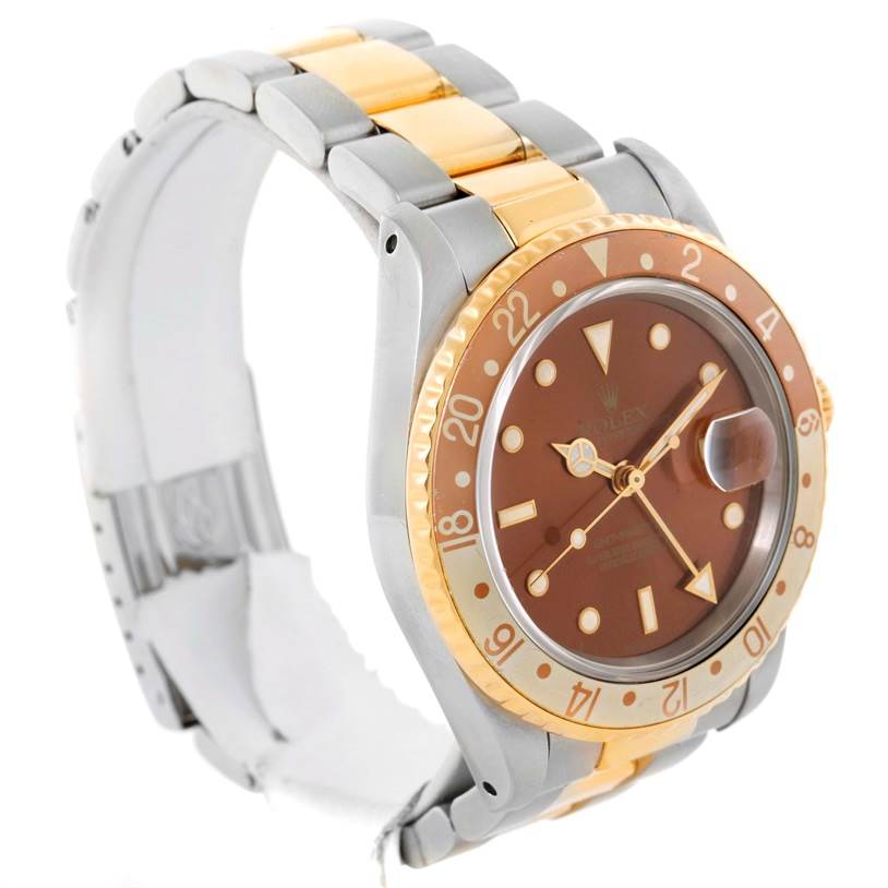 The Rolex GMT-Master 16713 Men's Stainless Steel Brown Dial 16713 Men's Stainless Steel Brown Dial watch is shown at an angle highlighting its dial, bezel, and two-tone bracelet.