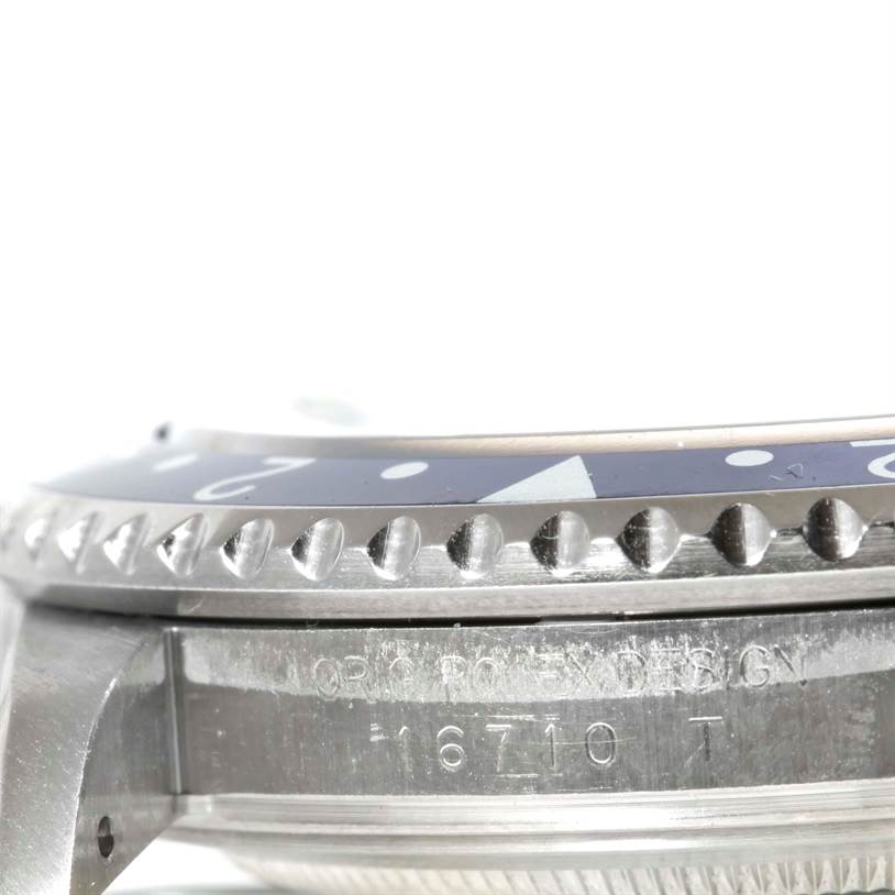 This image shows a side angle of the bezel and case of a Rolex GMT-Master 16710 Men's Stainless Steel Black Dial 16710 Men's Stainless Steel Black Dial watch, model 16710 T.