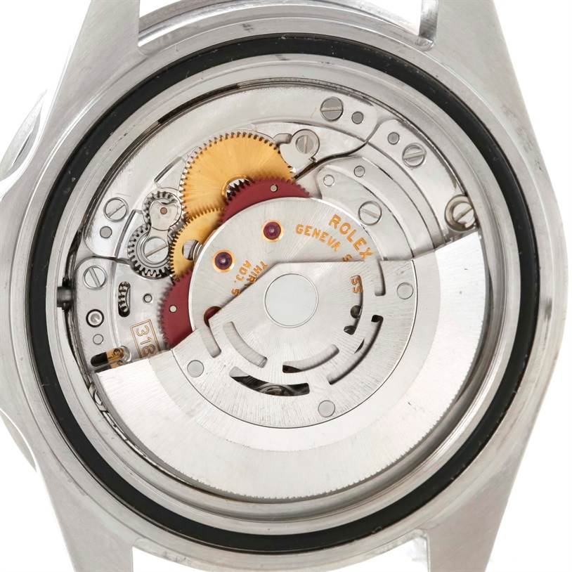 The image shows the back view of a Rolex GMT-Master 16710 Men's Stainless Steel Black Dial 16710 Men's Stainless Steel Black Dial watch, revealing its internal mechanical movement parts.