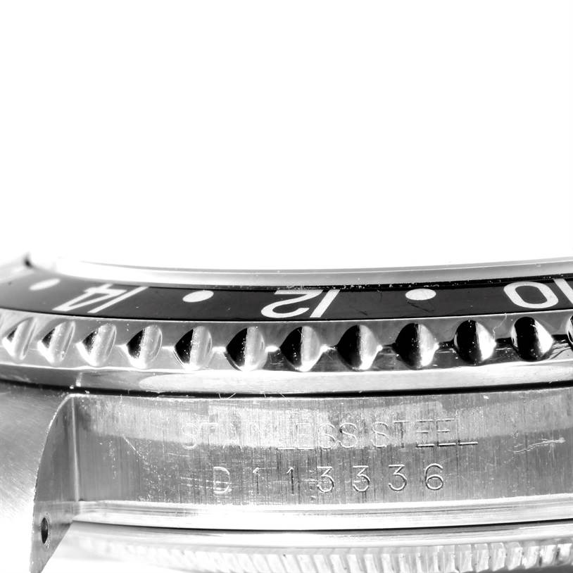 The image shows a close-up side view of the bezel and case side of a Rolex GMT-Master 16710 Men's Stainless Steel Black Dial 16710 Men's Stainless Steel Black Dial watch.