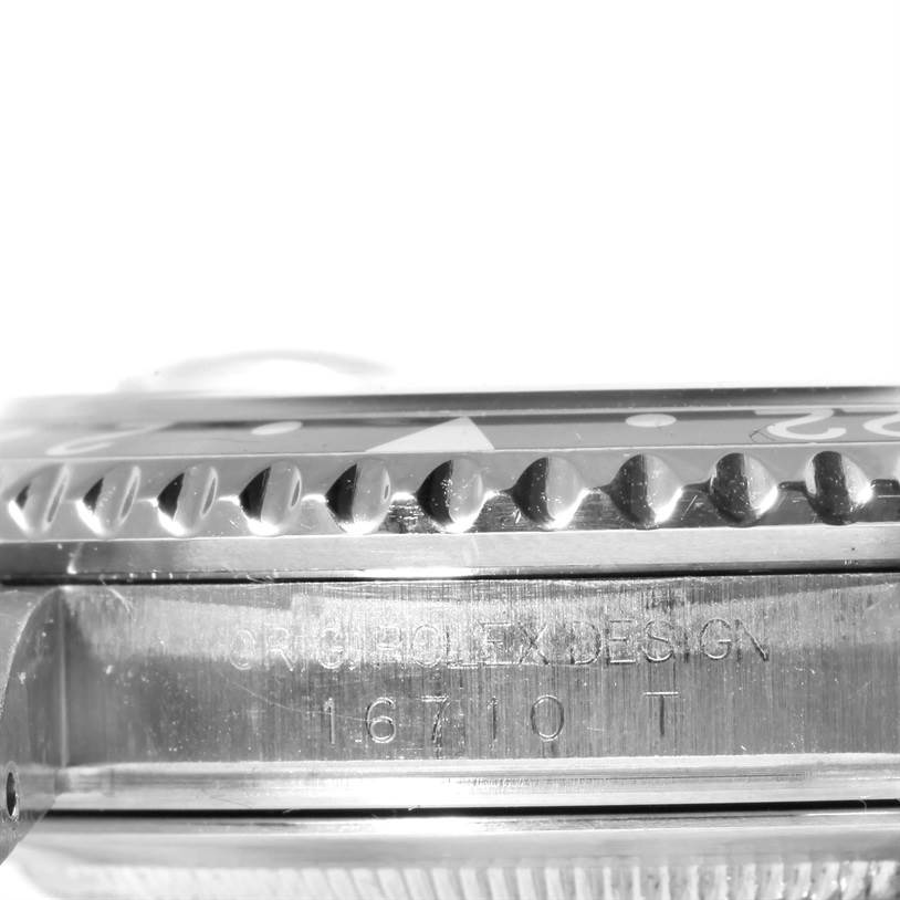 This image shows a close-up side view of the bezel and case of the Rolex GMT-Master 16710 Men's Stainless Steel Black Dial 16710 Men's Stainless Steel Black Dial model, with the model number engraved.
