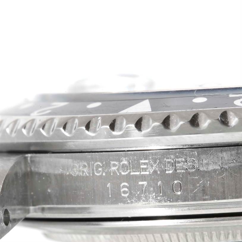 This close-up image shows the side profile of a Rolex GMT-Master 16710 Men's Stainless Steel Black Dial 16710 Men's Stainless Steel Black Dial watch, focusing on the bezel and reference number 16710 on the case.