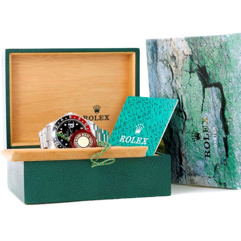 The image shows a Rolex GMT-Master 16710 Men's Stainless Steel Black Dial 16710 Men's Stainless Steel Black Dial watch in its box, accompanied by official documents and packaging.