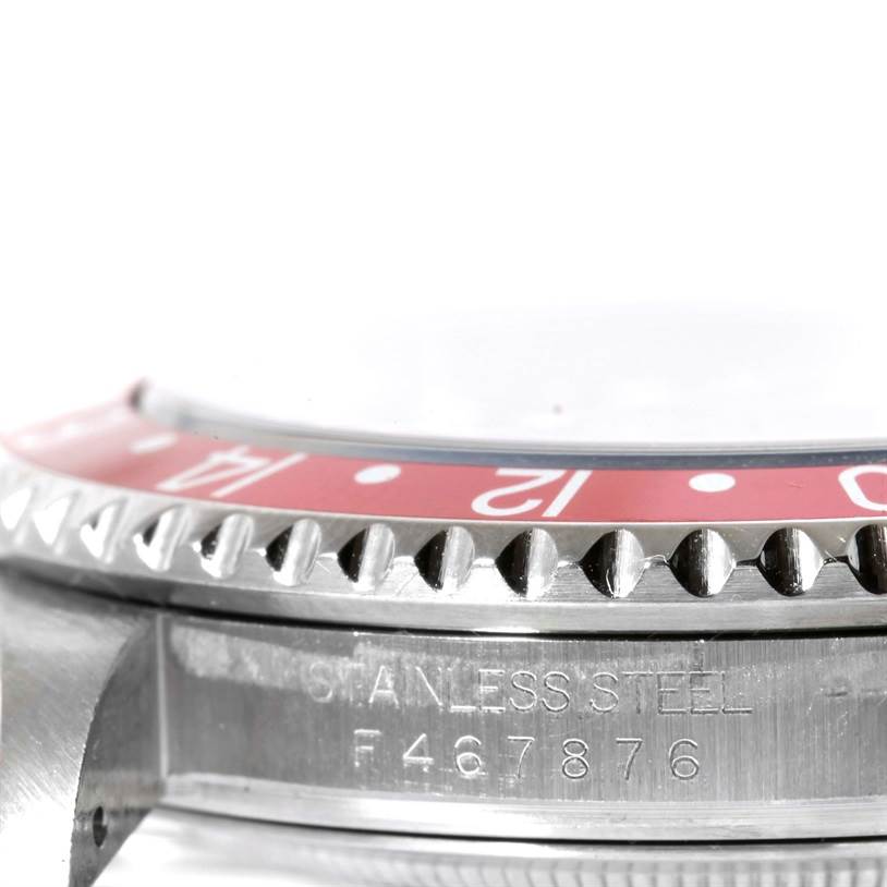 This image shows a close-up, side view of the stainless steel bezel and casing of a Rolex GMT-Master 16710 Men's Stainless Steel Black Dial 16710 Men's Stainless Steel Black Dial watch.