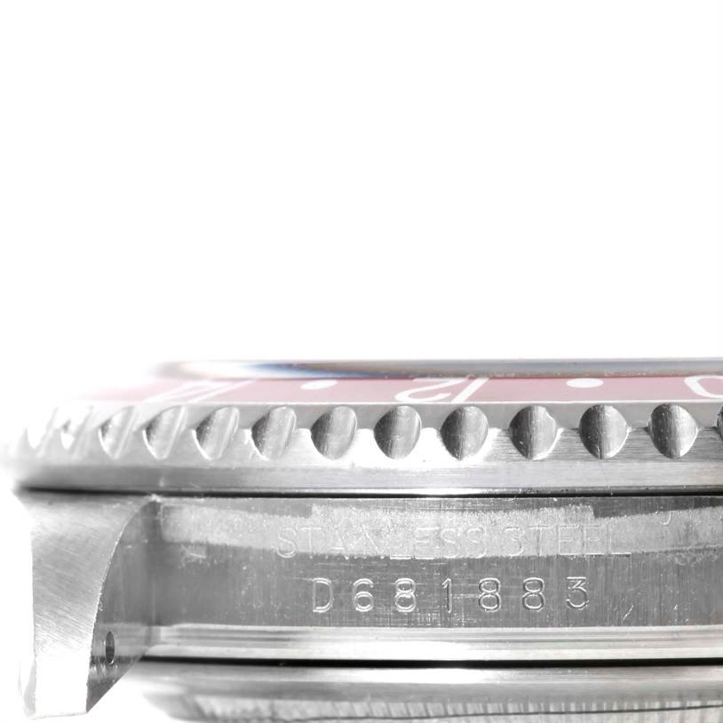 The image shows a close-up side view of the bezel, case, and serial number of a Rolex GMT-Master 16710 Men's Stainless Steel Black Dial 16710 Men's Stainless Steel Black Dial watch.