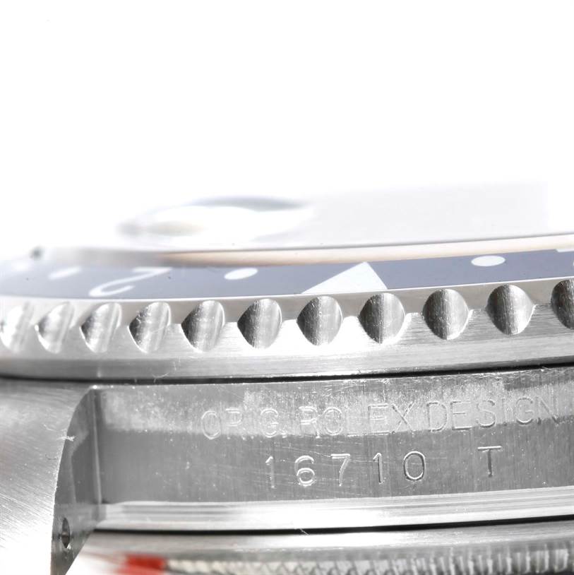 This close-up angle shows the bezel and part of the case with engraving on the Rolex GMT-Master 16710 Men's Stainless Steel Black Dial 16710 Men's Stainless Steel Black Dial model 16710.