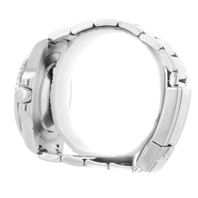 This side view of the Rolex GMT-Master 116710 Men's Stainless Steel Black Dial 116710 Men's Stainless Steel Black Dial watch highlights the crown, case, and bracelet.