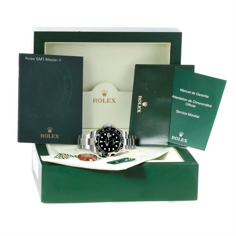The image shows a Rolex GMT-Master 116710 Men's Stainless Steel Black Dial 116710 Men's Stainless Steel Black Dial II watch at a front angle, displayed with its box, manuals, and warranty cards.