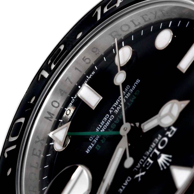 The image shows a close-up angle of the dial and bezel of a Rolex GMT-Master 116710 Men's Stainless Steel Black Dial 116710 Men's Stainless Steel Black Dial watch, highlighting the hour markers and hands.
