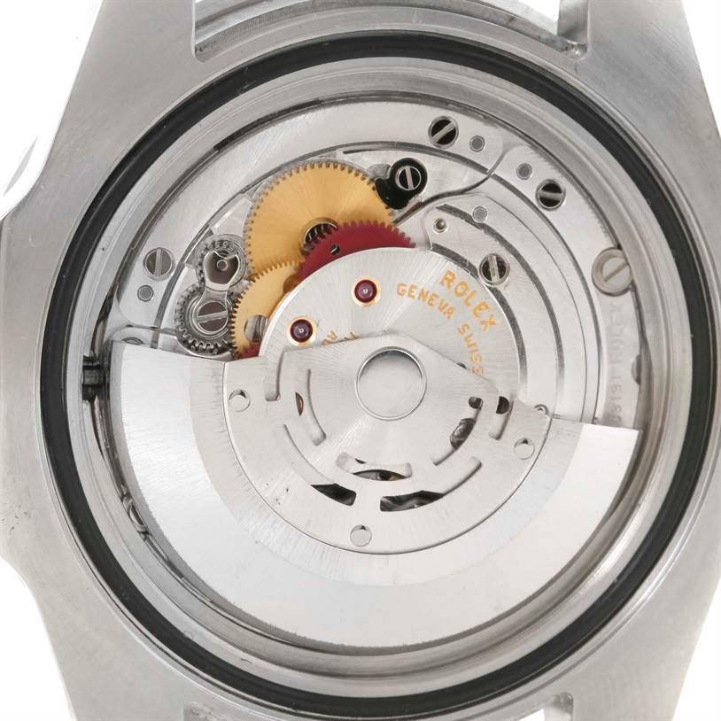 The image shows the backside and internal mechanisms of the Rolex GMT-Master 116710 Men
s Stainless Steel Black Dial 116710 Men
s Stainless Steel Black Dial watch, revealing its intricate gears and movement.