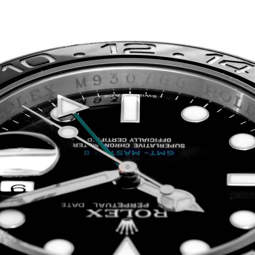 Close-up of a Rolex GMT-Master 116710 Men
s Stainless Steel Black Dial 116710 Men
s Stainless Steel Black Dial watch showing the bezel, part of the dial, and hands.