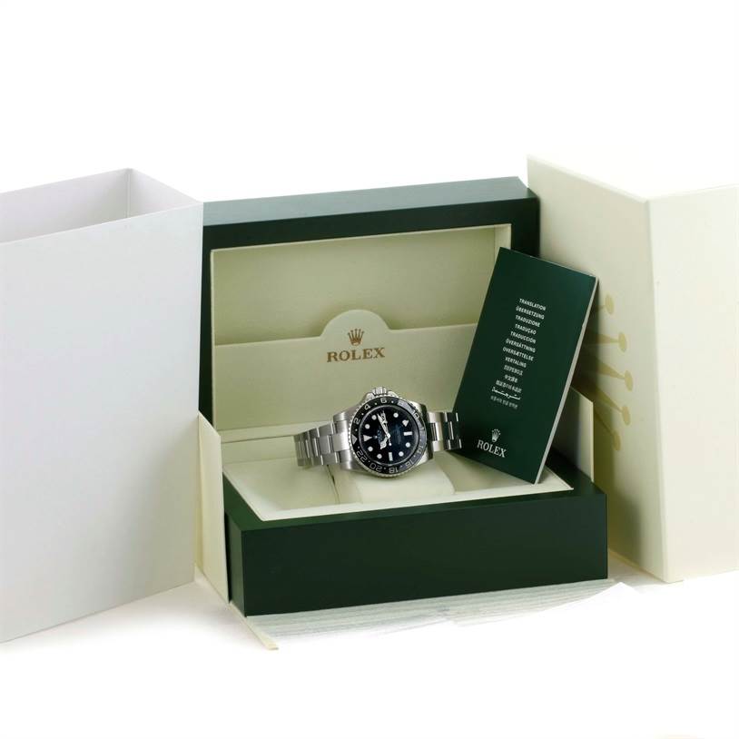 The Rolex GMT-Master 116710 Men
s Stainless Steel Black Dial 116710 Men
s Stainless Steel Black Dial watch is shown inside its green box from a front angle, along with a green booklet.