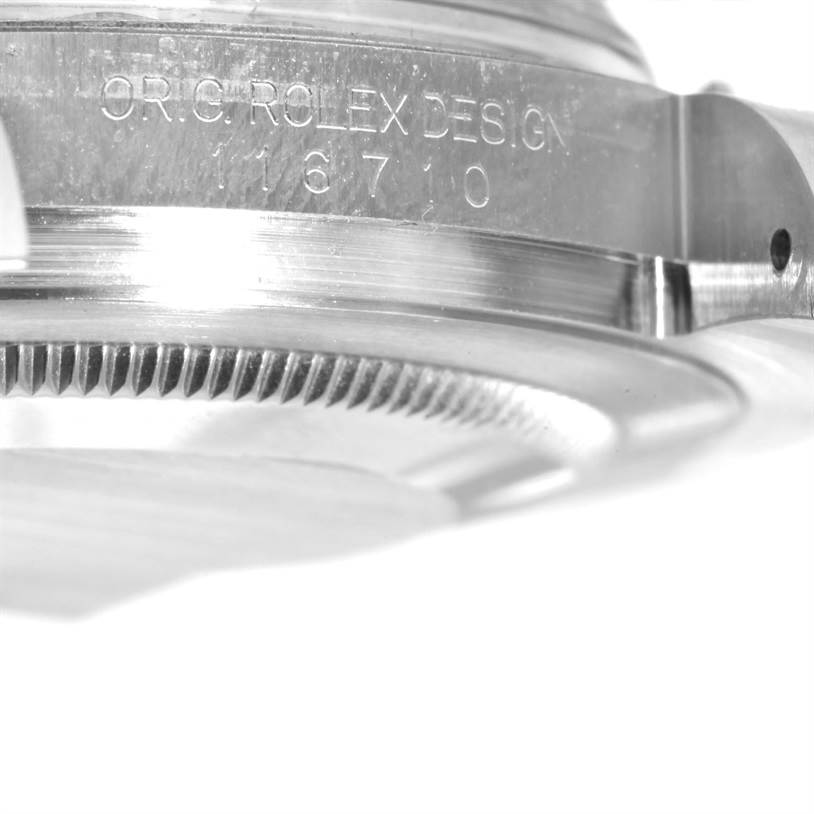 This close-up image shows the case side and edge of the bezel of the Rolex GMT-Master 116710 Men's Stainless Steel Black Dial 116710 Men's Stainless Steel Black Dial with model number 16710 engraved.