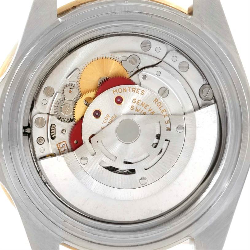 This image shows the internal mechanism and movement of a Rolex GMT-Master 16713 Men's Stainless Steel Brown Dial 16713 Men's Stainless Steel Brown Dial watch from a rear angle.