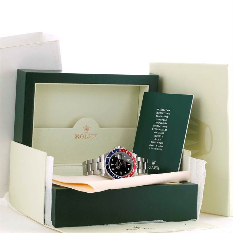The image shows a Rolex GMT-Master 16710 Men's Stainless Steel Black Dial 16710 Men's Stainless Steel Black Dial watch in its open box, along with the instruction booklet and packaging materials.
