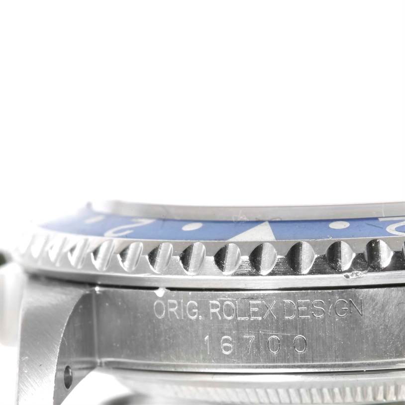 This image shows a side view of a Rolex GMT-Master 16700 Men's Stainless Steel Black Dial 16700 Men's Stainless Steel Black Dial watch, focusing on its bezel, crown guard, and model number 16700 engraved on the case.