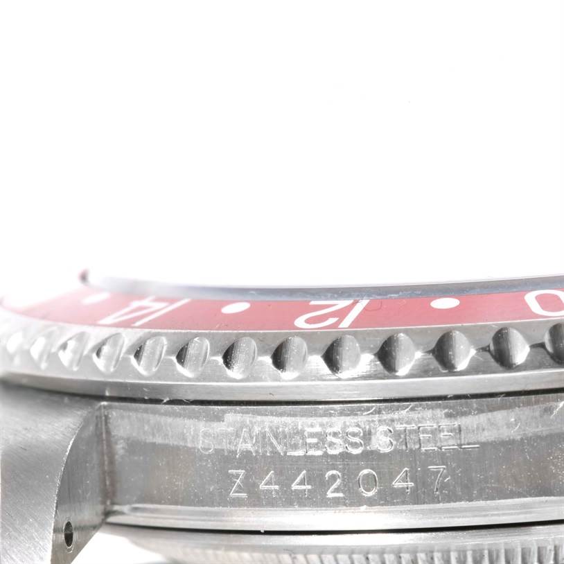 This image shows a close-up side view of the bezel and case of a Rolex GMT-Master 16710 Men's Stainless Steel Black Dial 16710 Men's Stainless Steel Black Dial watch model.