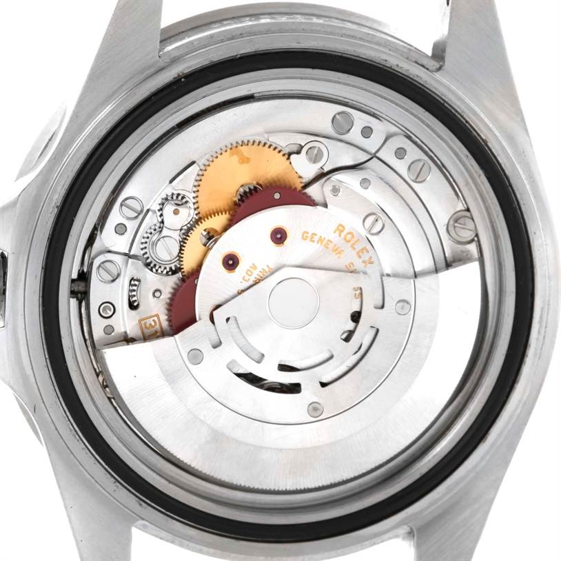 This image shows the back of a Rolex GMT-Master 16710 Men's Stainless Steel Black Dial 16710 Men's Stainless Steel Black Dial watch, highlighting its internal movement and gears.