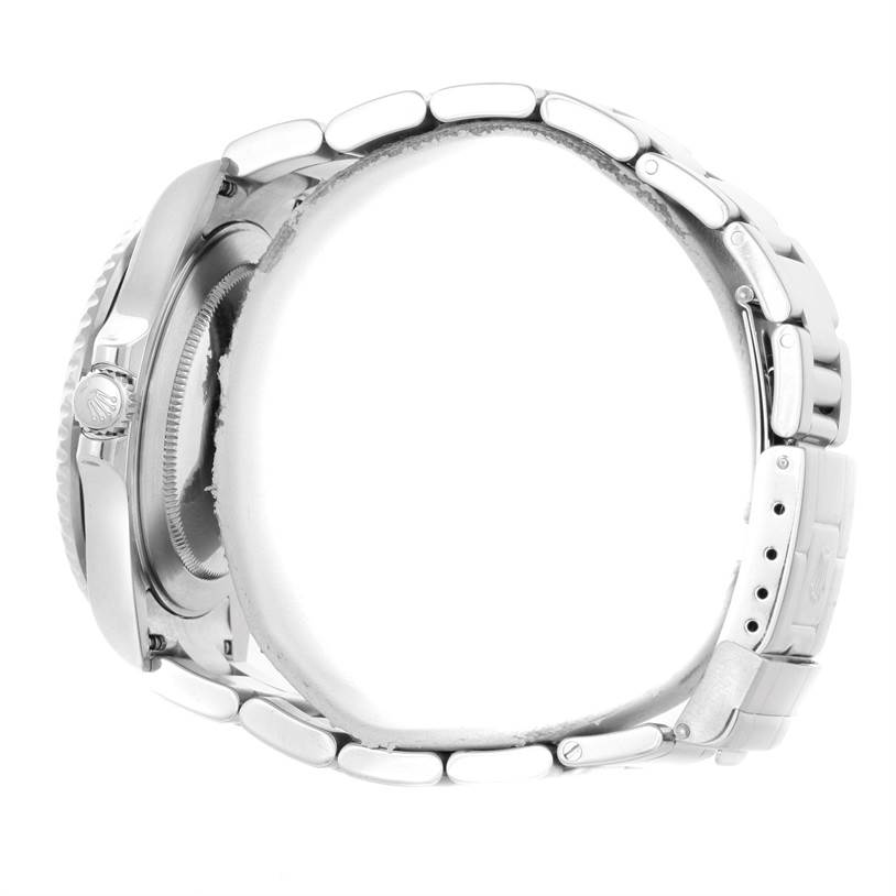 This side view image of the Rolex GMT-Master 16710 Men's Stainless Steel Black Dial 16710 Men's Stainless Steel Black Dial watch shows part of the case, crown, and stainless steel bracelet.