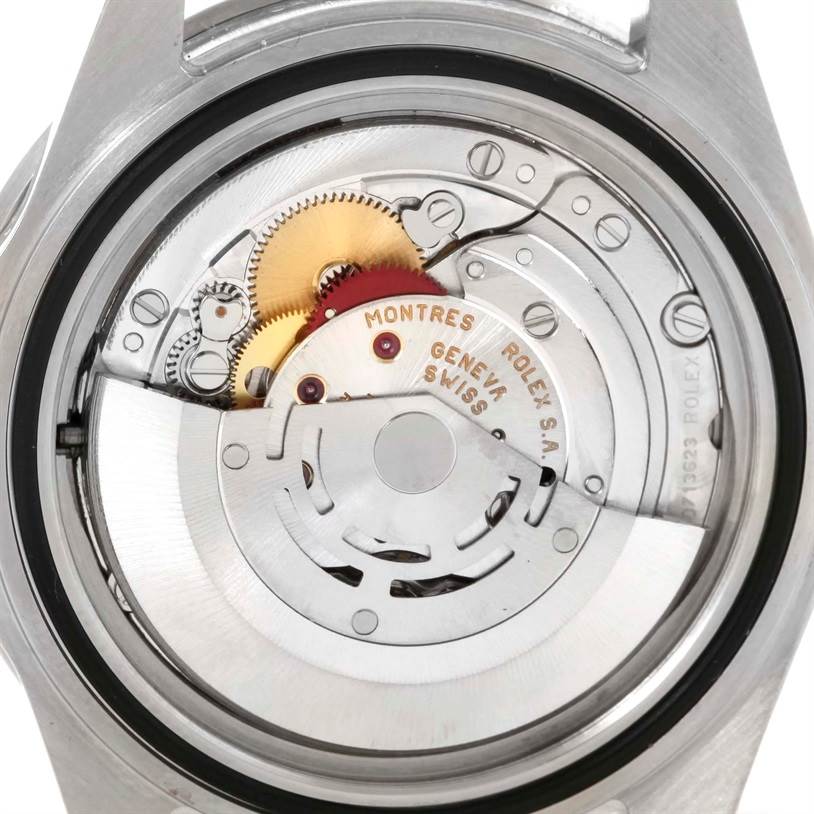 This image displays the intricate movement mechanisms inside the back casing of a Rolex GMT-Master 16710 Men's Stainless Steel Black Dial 16710 Men's Stainless Steel Black Dial watch.